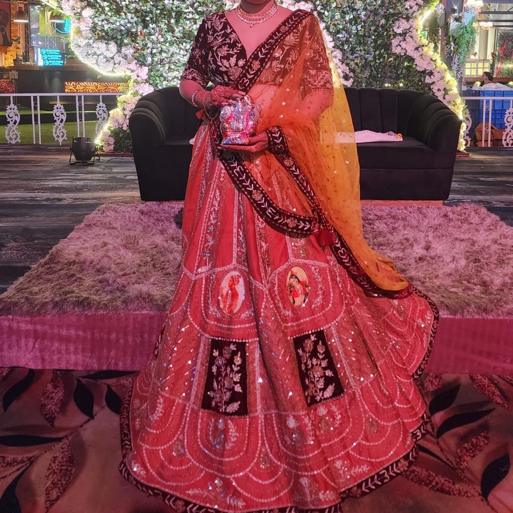 Vibrant Orange and dark red Embroidered Lehenga.Designed by Naina Kapoor